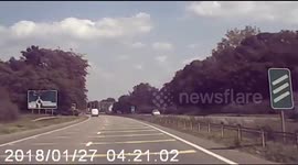 Shocking moment speeding van is filmed flying over roundabout