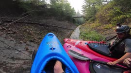 Three kayakers race down storm drain at 50mph