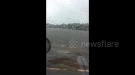 Residents drive through flooded roads as Hurricane Florence nears Carolina coast