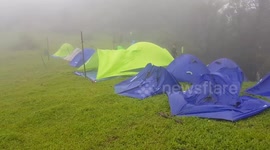 Tents flattened by heavy winds
