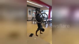 Inspirational Montreal student does handstand push-ups in wheelchair