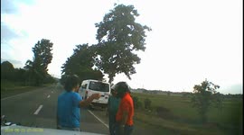 Motorcyclist slams in to back of swerving van