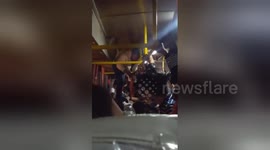 Bus driver dubbed 'spiderman' after dangling from roof to collect fares