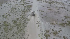 Makgadikgadi 4x4 driving, water crossing drone video