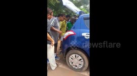 Man smells something stinking inside his car and finds a snake