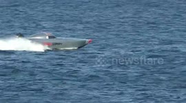 Power boat races, where one Speed boat almost smashes into a spectators boat, missing it by just a few feet.