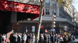 Crowd of impatient tourists waiting  for the opening of the Galeries Lafayette as every day; in general asian tourists. Paris 9th district, France