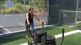 Woman Pushing A Lot of Weights