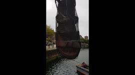 Giant sandal suspends over Liverpool dock for festival