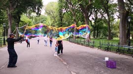 Slow motion footage of bubble man in Central Park, NY