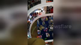 Shoppers flee in panic as mall floods following heavy rain