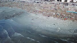 Drone footage shows the devastation as the Tsunami swept over the villages destroying everything in it's path.