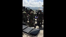 Injured arrive one truck load after another to Palu Airport to meet President Joko.