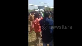 Indian farmers carry Air Force plane on shoulders after crash
