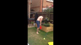 Dad get smacked in the face twice during family swingball game