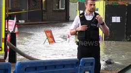 Floodwater up to car doors during the Lea Bridge flood