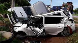 Woman's car flattened by out-of-control truck while waiting at junction
