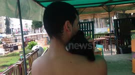 Puppy Relaxed In Mans Arms