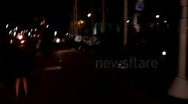 Occupy Democracy protesters hold up 'Real Democracy Now' banner outside the houses of parliament in Westminster