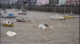 Capsized boats in harbour after Storm Callum