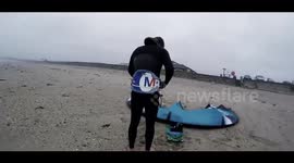 Brave kitesurfers take to the water during Storm Callum