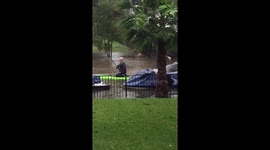 Resident kayaks through waterlogged street to rescue neighbor's boat as severe flooding hits Central Texas