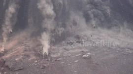 Incredible video shows near miss as huge lava bombs come crashing down around sightseeing boat around Krakatoa volcano