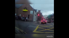 UK man's trousers fall down as he attempts to open car door with hands full