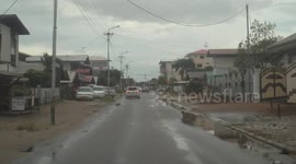Crazy Driver speeding with man on the hood