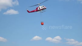 Helicopter water bucket drop