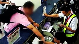 Chinese man slaps airport worker in face with iPhone after flight cancelled
