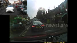 Taxi can't wait in queue of traffic at a crossing, so decides to overtake using the wrong side of road