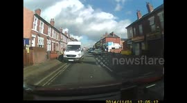 Car overtakes me in a 20mph zone on the wrong side of the road and passing a mini pedestrian island