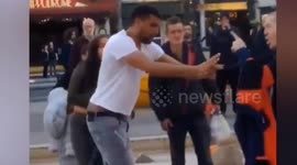 Passerby breaks up fight between two men in broad daylight