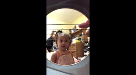 Baby trying to play guitar