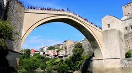 man jumps off stari most bridge in mostar bosnia and herzegovina