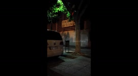 Man pushing cart with the back