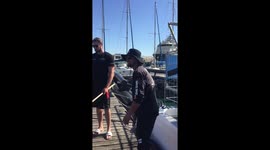 Man jumps into the ocean to collect plastic and exhausts himself