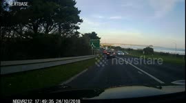 German SUV in a very very near miss with an Audi. After the tourist attempts to turn right from the left lane on a roundabout with no indication at all. Poor driving from the Hyundai and skilful driving from the Audi. A30 Penzance, Cornwall, UK