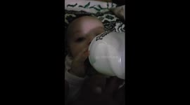 4 month baby enjoying milk time