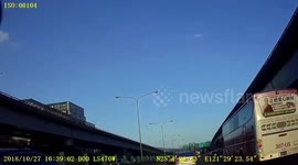 Driver swerves out of the way as truck hits overhead motorway sign