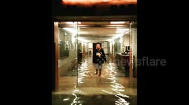 Model does catwalk through flooded Venice hotel lobby