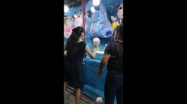 Two women come to blows at fair ground coconut shy after player is accused of cheating