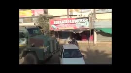 Overtaking car is pushed along after coming in front of anti-landmine truck