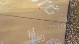 Streets of Arizona college town colorfully chalked up with reminders to vote on Election Day