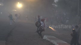 Indian villagers hurl homemade firecrackers at each other in mock war after Diwali