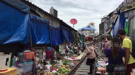 Maeklong Railway Market: come within inches of a moving train while you shop