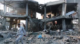 Palestinians inspect homes destroyed by Israeli air strike