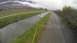 Wakeboarding along flooded streets in Switzerland