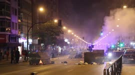 Protesters set fire to dumpsters in Burgos, Spain